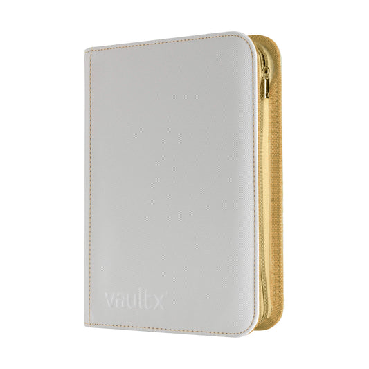 A Vault X zippered binder in white with gold stitching and zip, shown on a plain white background.